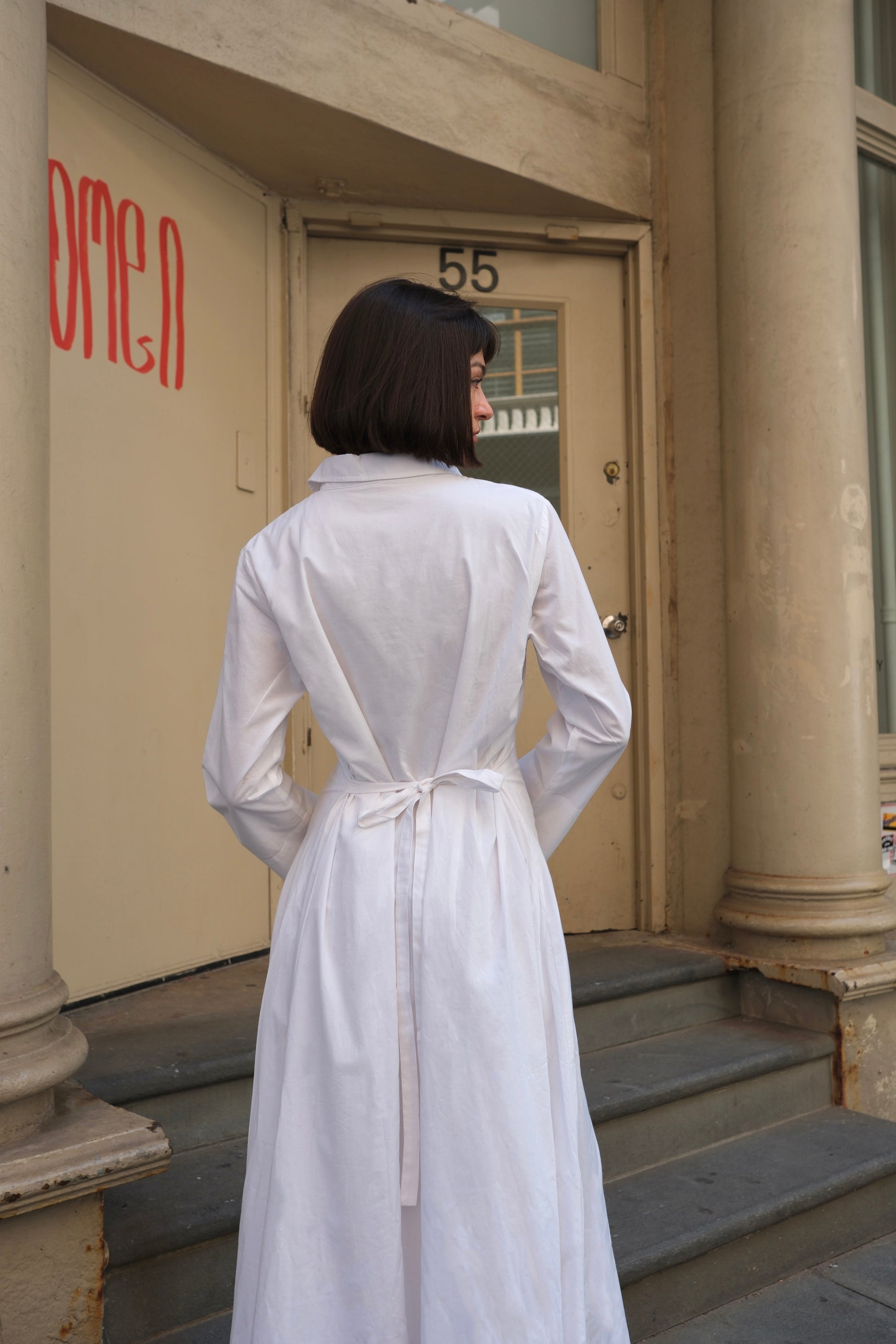 a white cotton maxi dress with long sleeve and cinched waist, modest dress sustainable