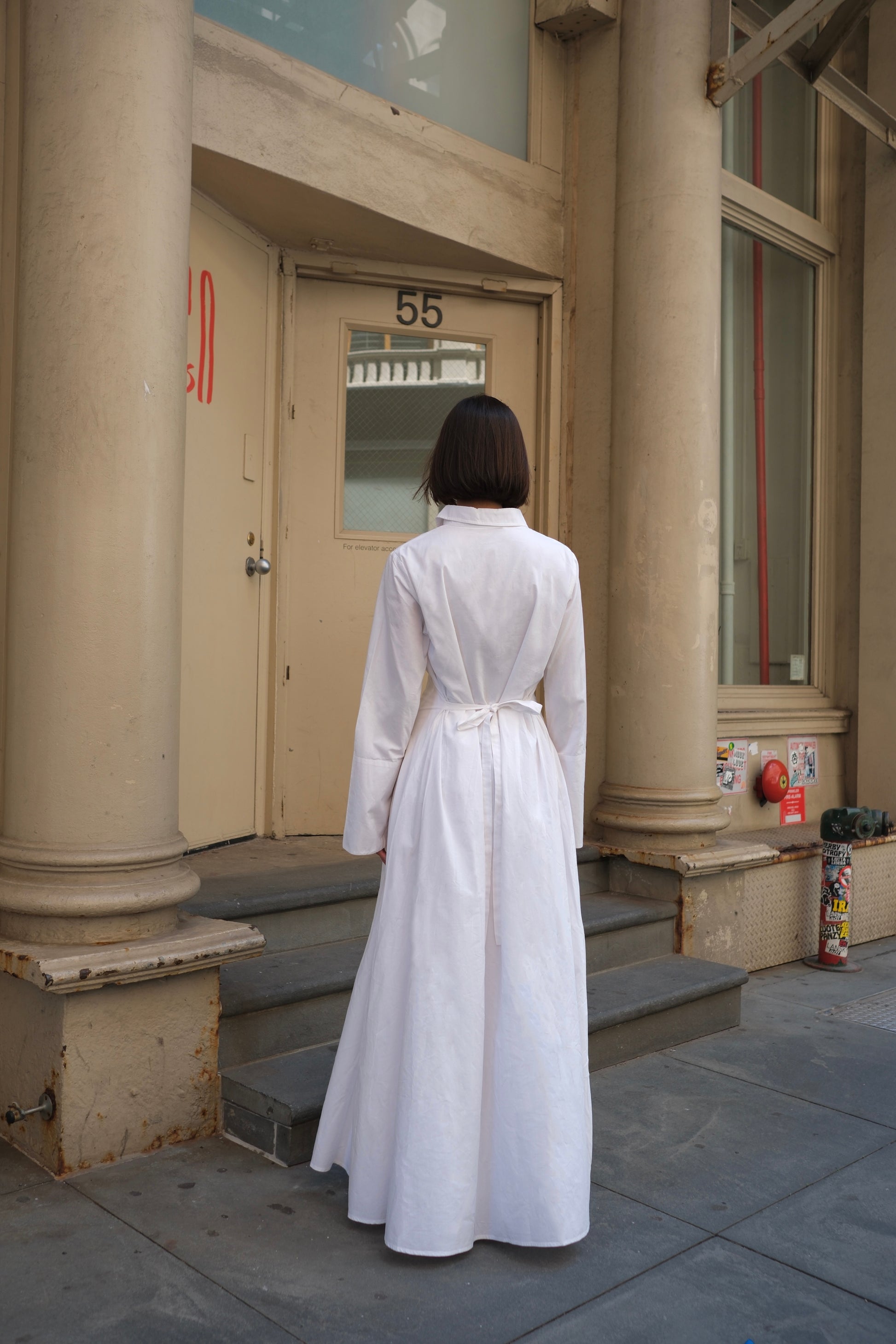 a white cotton maxi dress in long sleeve and cinched waist, modest dress sustainable